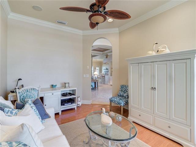 Den with wood floors to match the dining room