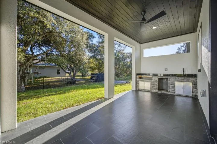 Unfurnished sunroom featuring a sink