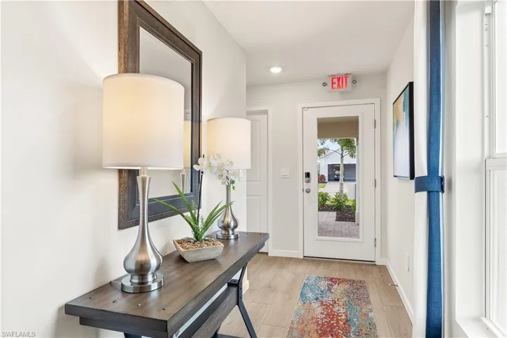 MODEL HOME - Foyer featuring light wood-style flooring and recessed lighting