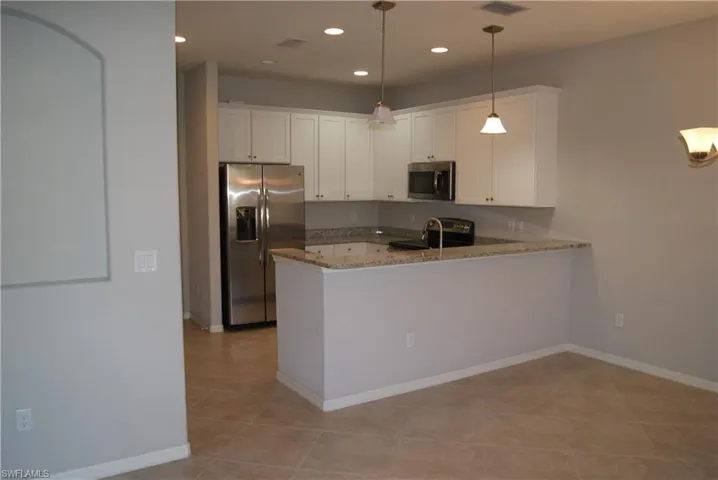 large modern kitchen and family room self closing doors