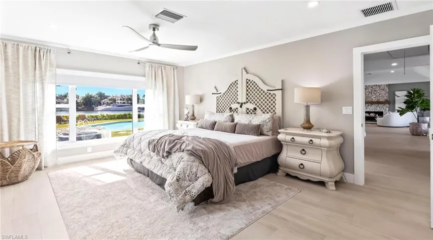 Bedroom with ceiling fan, recessed lighting, and light wood-style flooring