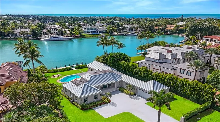 Aerial view of residential area with a nearby body of water