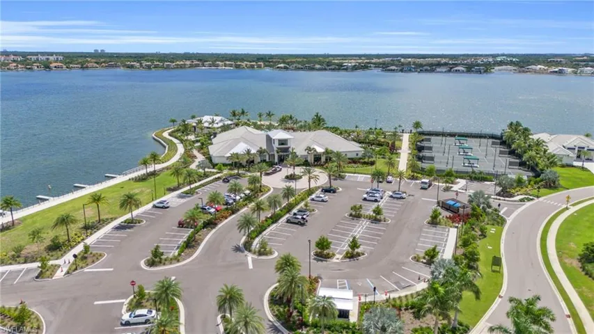 Birds eye view of property with a water view