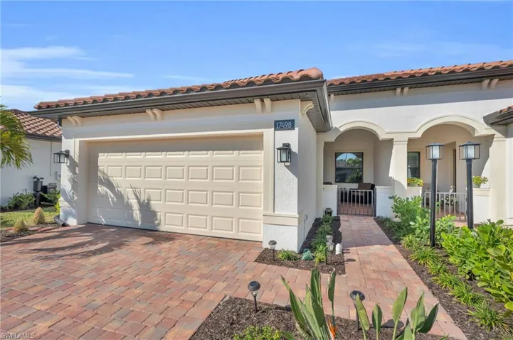 Mediterranean / spanish home featuring a garage