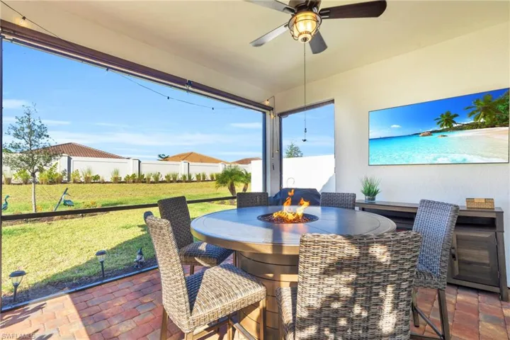 Sunroom / solarium featuring ceiling fan