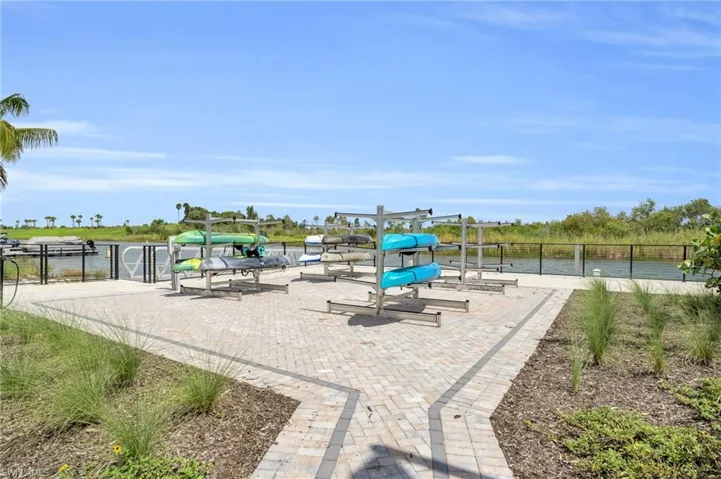 View of jungle gym featuring a water view