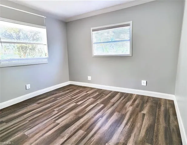 Bedroom featuring wood-type flooring VIRTUALLY EDITED