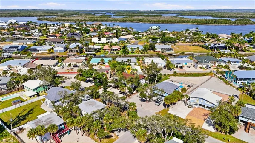 Aerial view of residential area with a large body of water - Virtually Edited Image