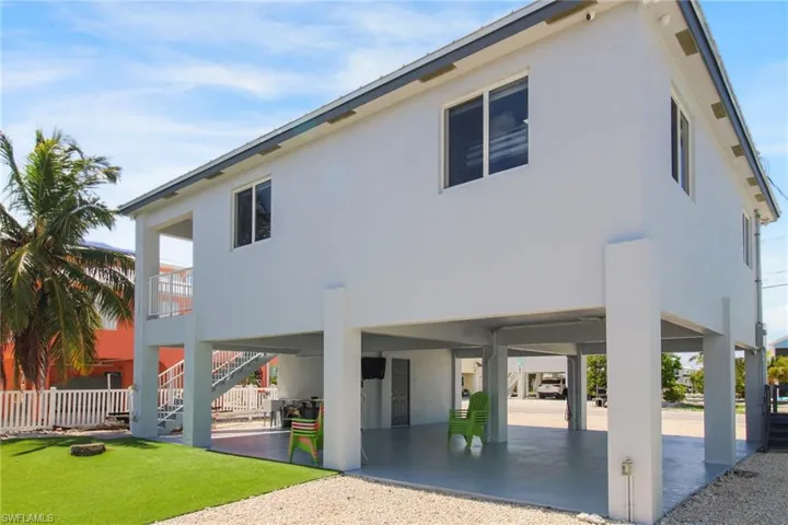 Back of property with a patio