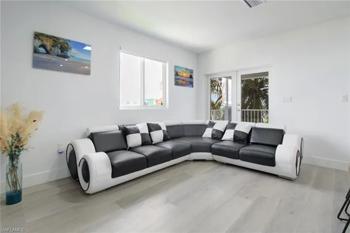 Living room featuring light hardwood / wood-style flooring and french doors