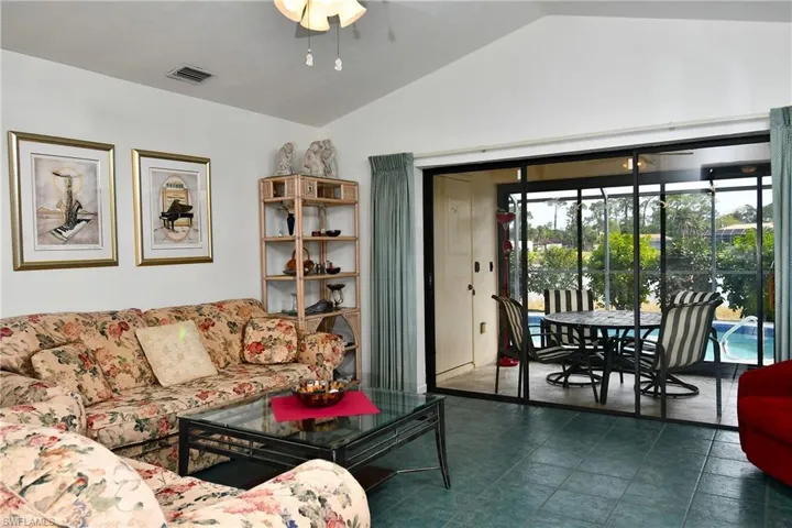 Living room with lofted ceiling