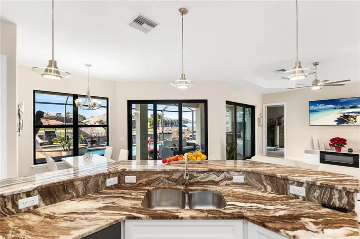 Kitchen with ceiling fan, and pendant lighting