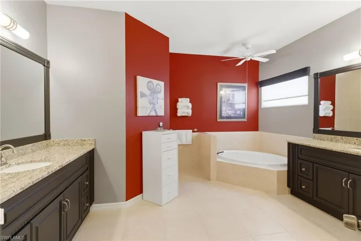 Spa-like retreat! Huge walk-in shower, dual vanities, and elegant finishes for ultimate relaxation.