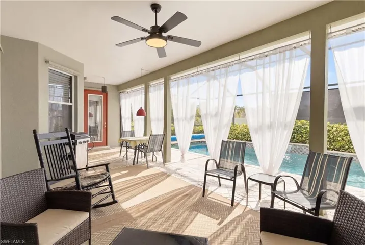 Outdoor elegance—relax and entertain on your covered lanai with poolside charm all around.