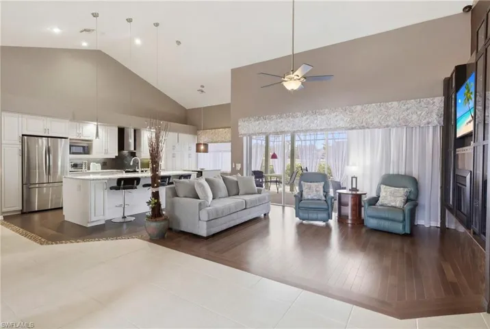 Bright, open, and inviting—this connected living and kitchen space is designed for modern Florida living.