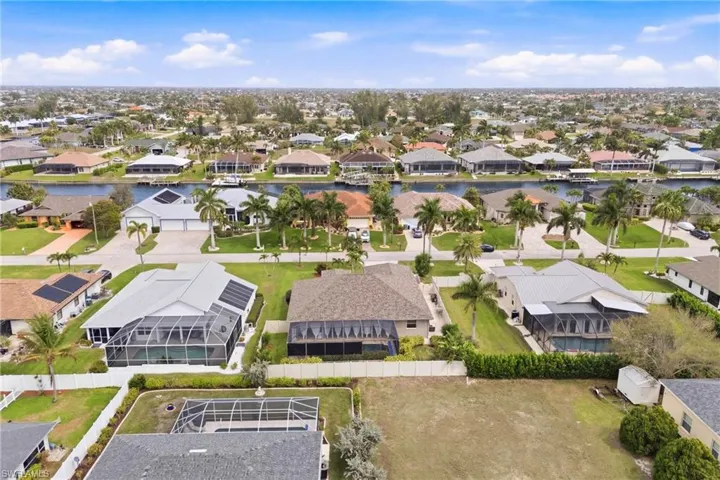 See your dream home in its entirety—sunlit lanai, sparkling pool, and tropical landscaping in perfect harmony!
