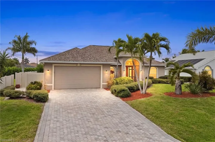 Curb appeal that wows! Elegant architecture, pristine landscaping, paver driveway and a fully fenced yard welcome you home.