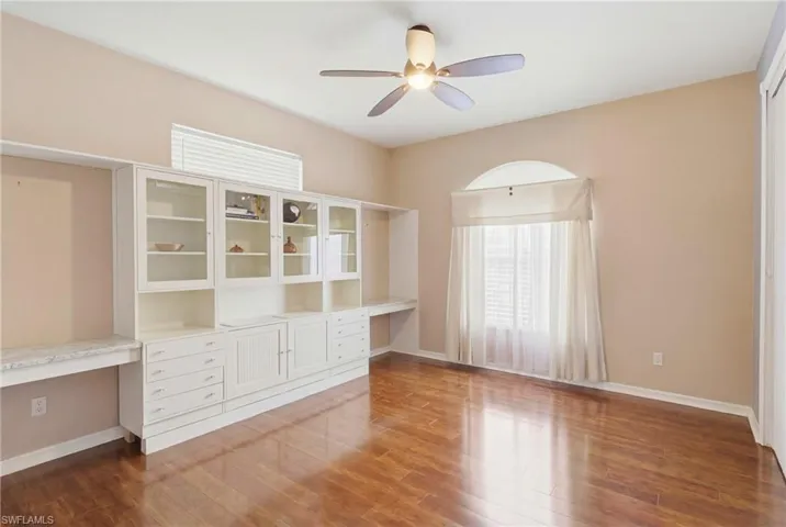 Guest bedroom with thoughtful design—built-in shelves for books, collectibles, or personal touches.