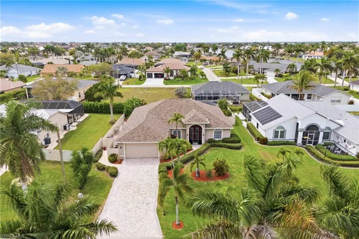From the sky, every detail shines—your home, pool, and tropical surroundings in perfect view.