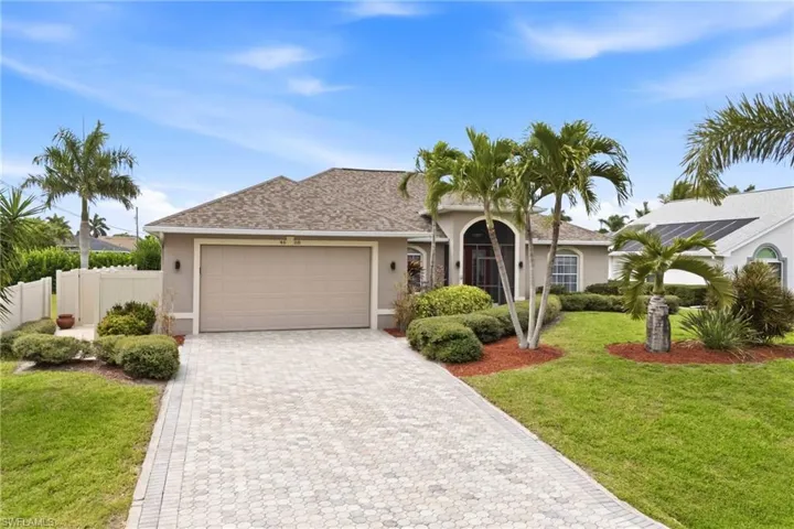 Elevated beauty—front-of-home view emphasizing style, landscaping, and Florida charm.