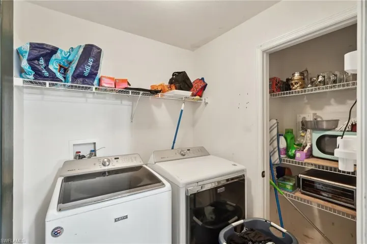Washroom featuring washer and clothes dryer