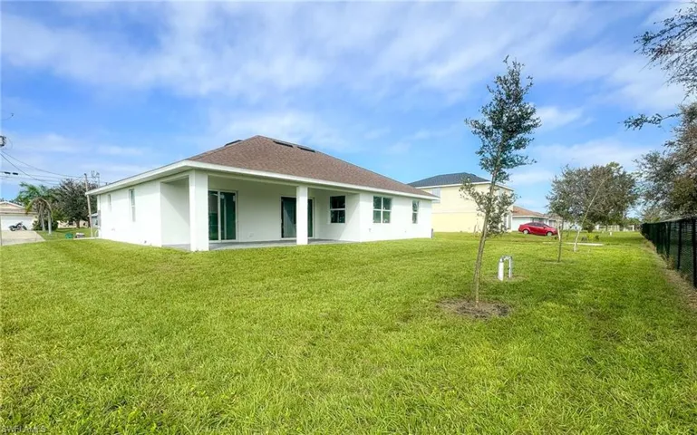 Back of house with a big yard