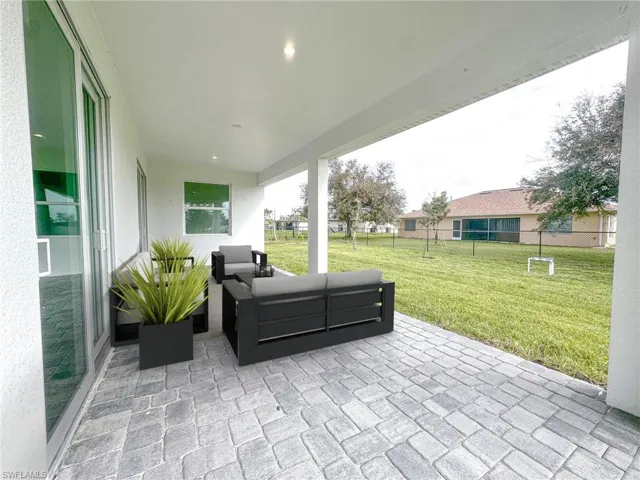 Lanai Deco RenderView of patio / terrace featuring an outdoor living space