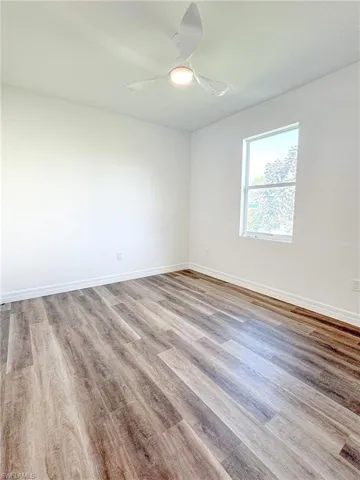 Bedroom #3 Empty room featuring light wood-type flooring and ceiling fan