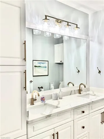 Bathroom featuring double vanity