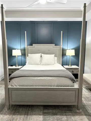 Bedroom featuring a decorative wall and ornamental molding