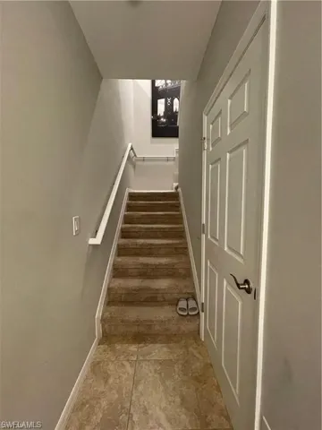 Stairs featuring baseboards