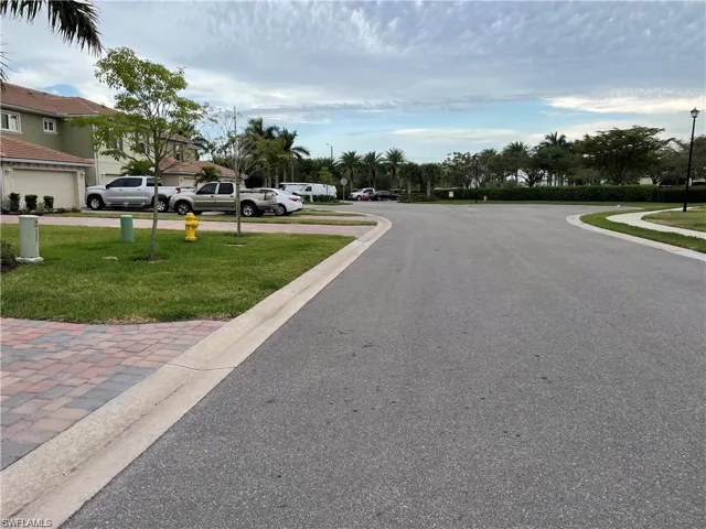 View of road with curbs and street lighting