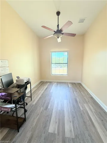 Office featuring light wood-type flooring and ceiling fan
