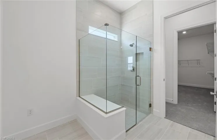 Bathroom featuring tile floors and walk in shower