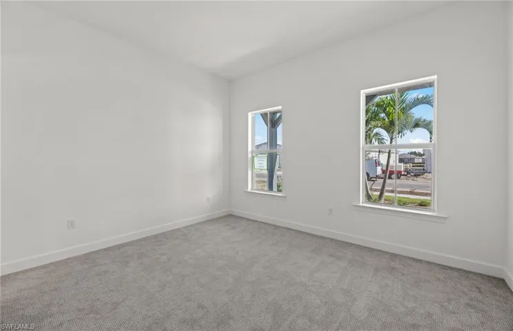 Unfurnished room with carpet flooring