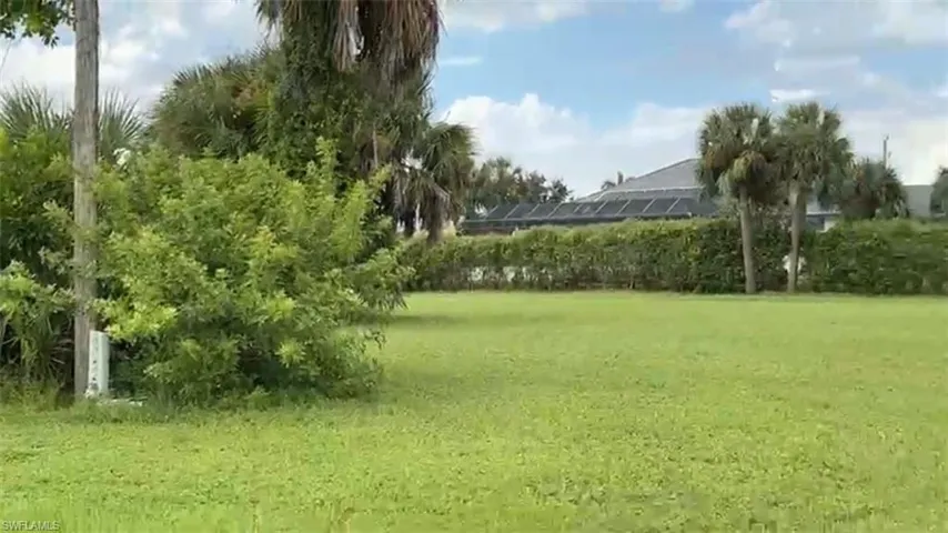View of community featuring a yard