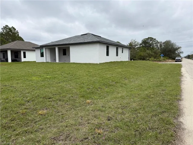 View of home's exterior with a lawn