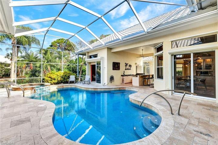 This HUGE lanai with SO MUCH covered space, heated pool/spa will be your favorite place to relax!