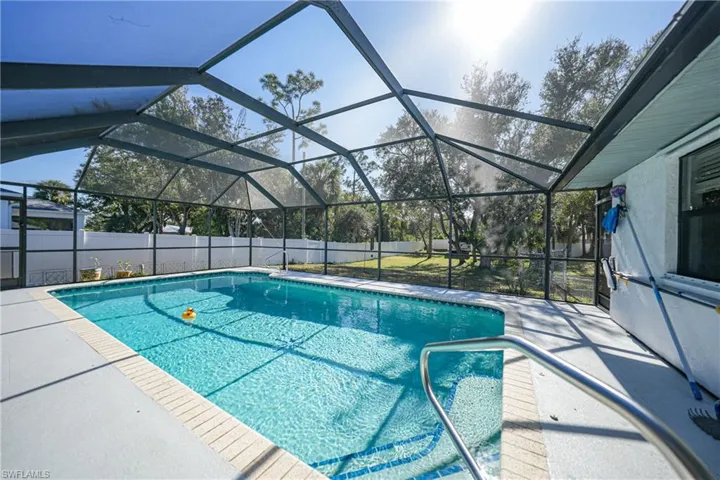 View of pool featuring a patio and a lanai