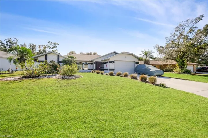 View of yard with a garage
