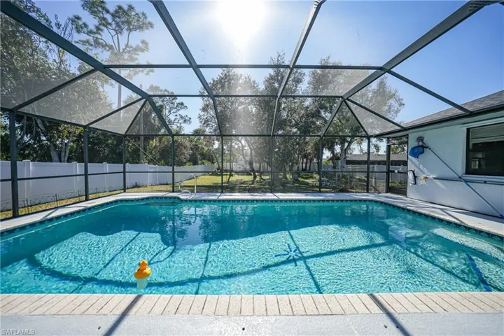 View of pool featuring a lanai