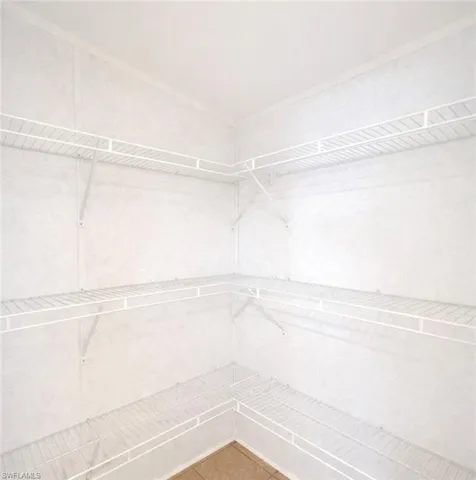 Partial view of master walk in closet