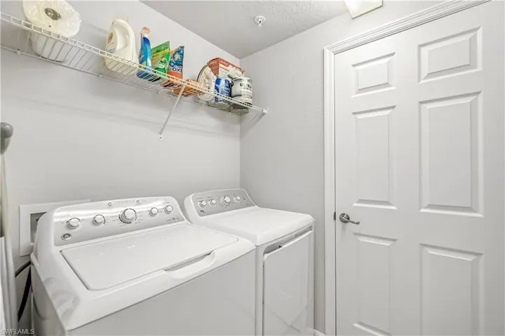 Washroom featuring washing machine and clothes dryer