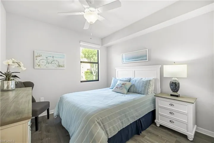 Bedroom featuring dark wood-type flooring and a ceiling fan