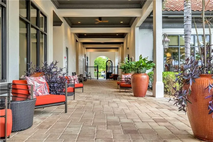 Community lobby featuring ornamental molding and beamed ceiling