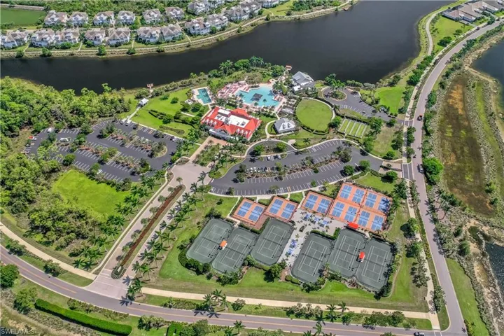 Aerial overview of property's location with a large body of water and nearby suburban area