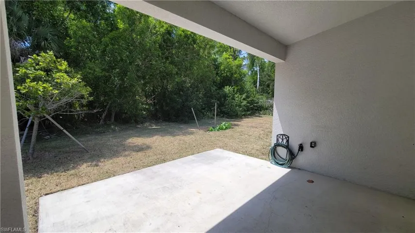 View of lawn with patio