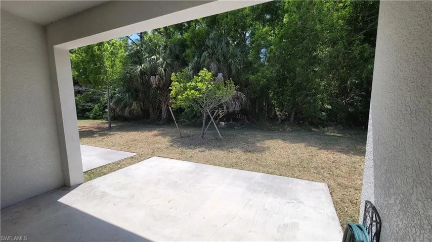 View of lawn with patio