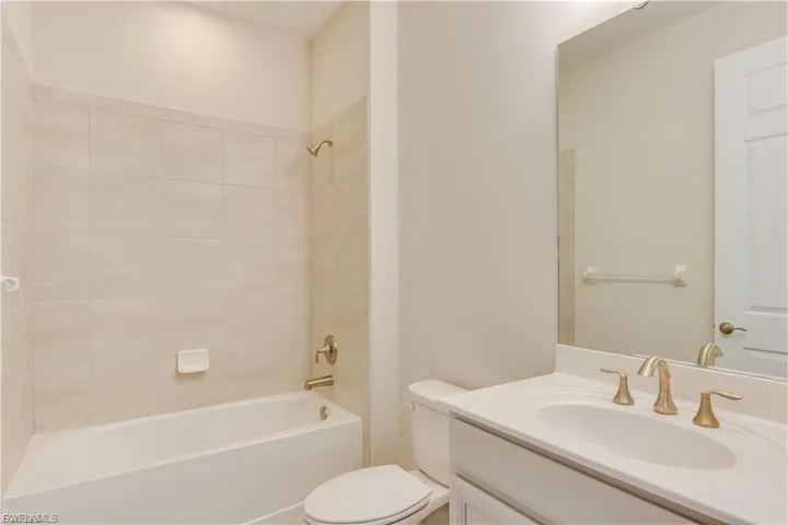 Bathroom with bathtub / shower combination and vanity