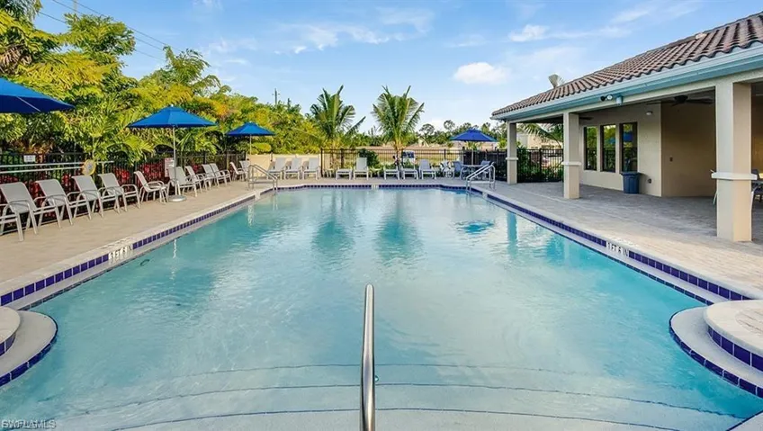 Community pool with a patio area